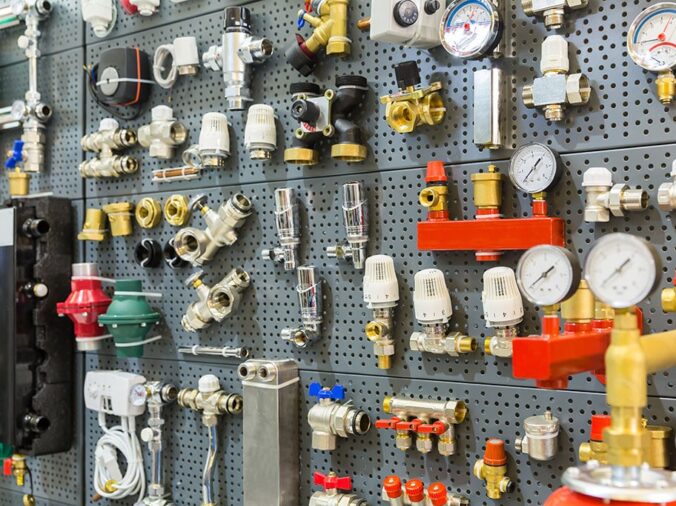 varous plumbing fittings and connectors in a plumbing supply store