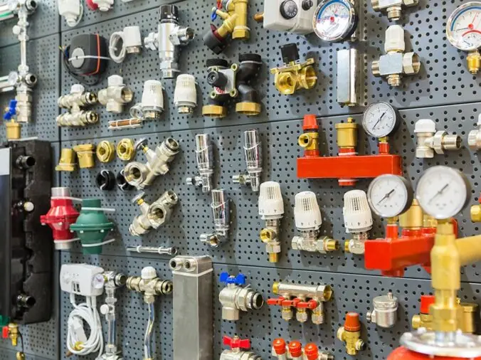 varous plumbing fittings and connectors in a plumbing supply store
