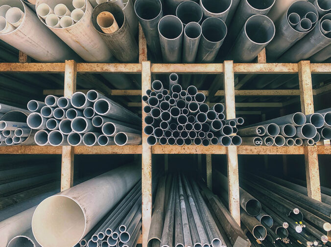 PVC and steel pipes in a plumbing warehouse